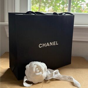 CHANEL Black Gift Bag with White Flower Accent
